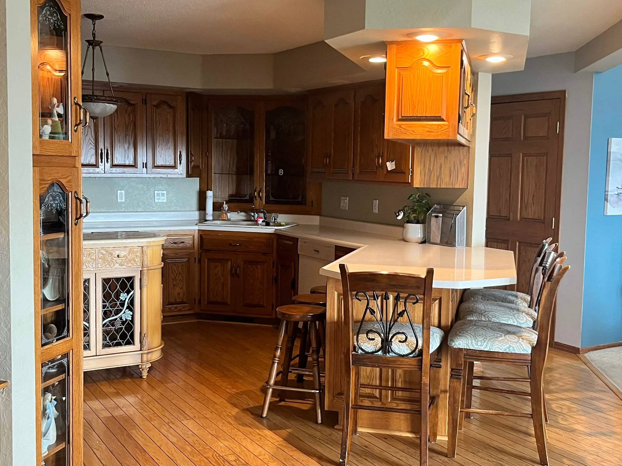 Kitchen with oak cabinets and breakfast bar